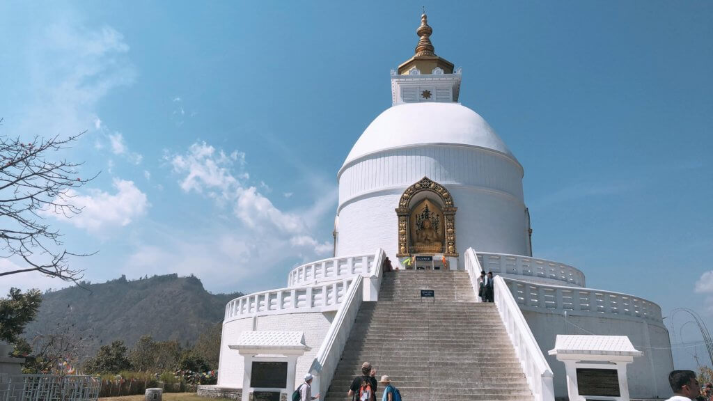 visiting the peace pagoda in the most adventurous destination in Nepal.