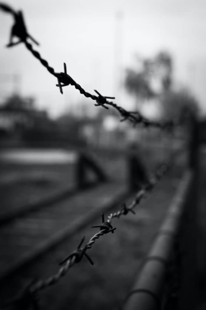 Barbed wired fences guarding the Auschtwitz Prison