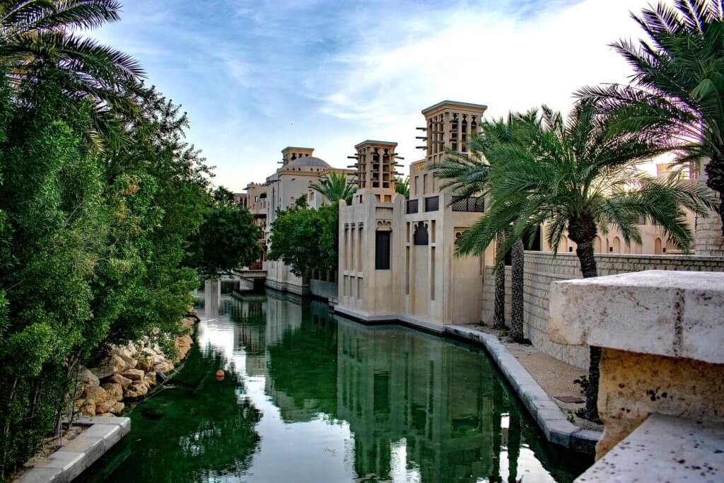 beautiful canal surround by traditional souk like buildings 