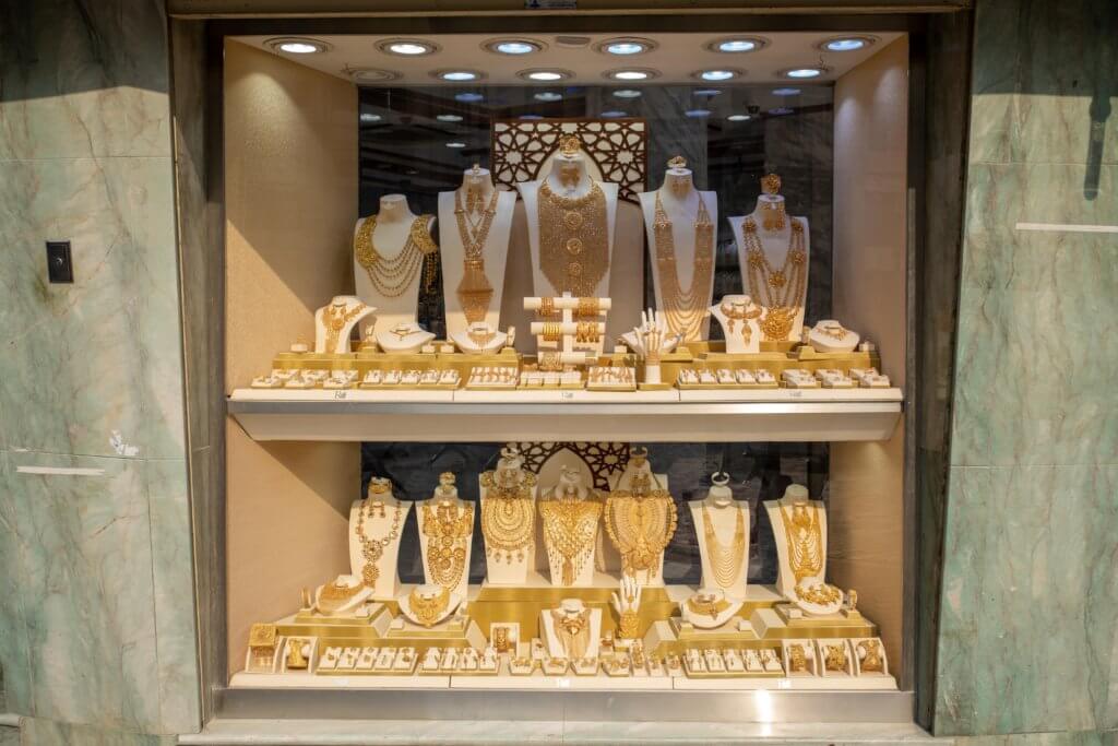 showcase filled with gold ornaments